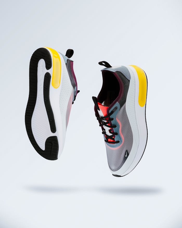 Floating modern sneakers showcasing trendy design and vibrant colors.