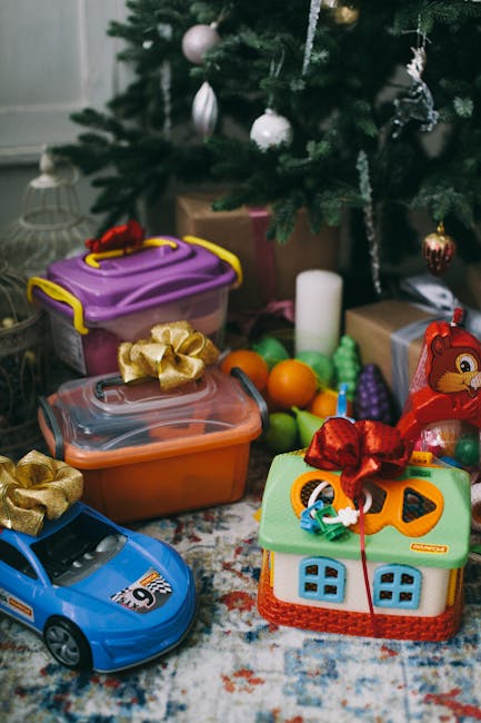 Christmas gifts and toys arranged under a decorated tree, perfect for festive scenes.