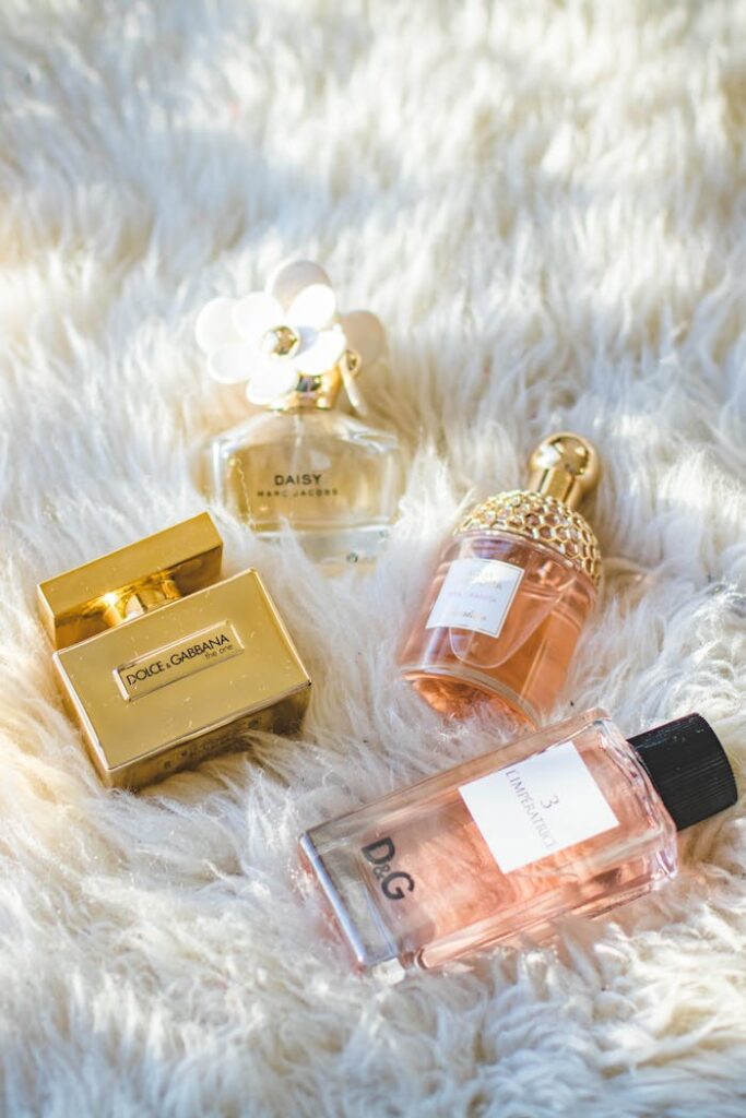 A collection of elegant perfume bottles arranged on a plush fur surface, showcasing luxury and sophistication.